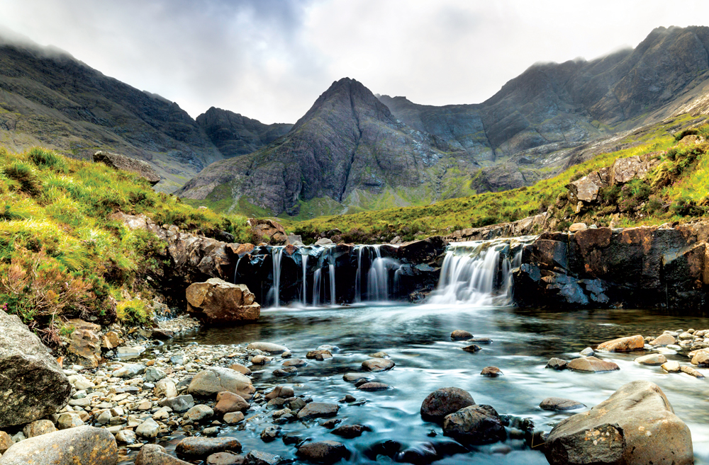 The Fairy Pools in the shadow of the Cuillin mountains have enticed travellers from all over. Photo by Visit Scotland